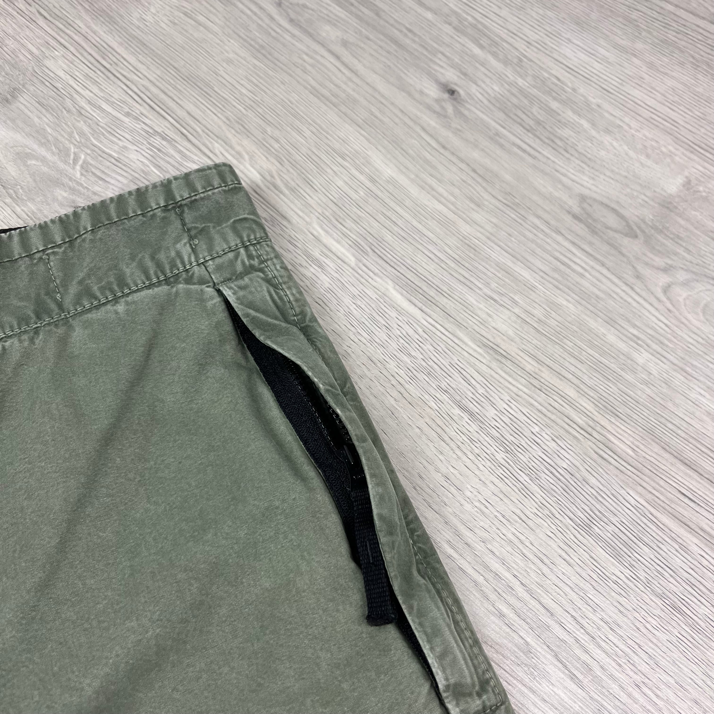 Stone Island Bermuda Cargo Shorts in Musk Green. On sale at Open Attire.