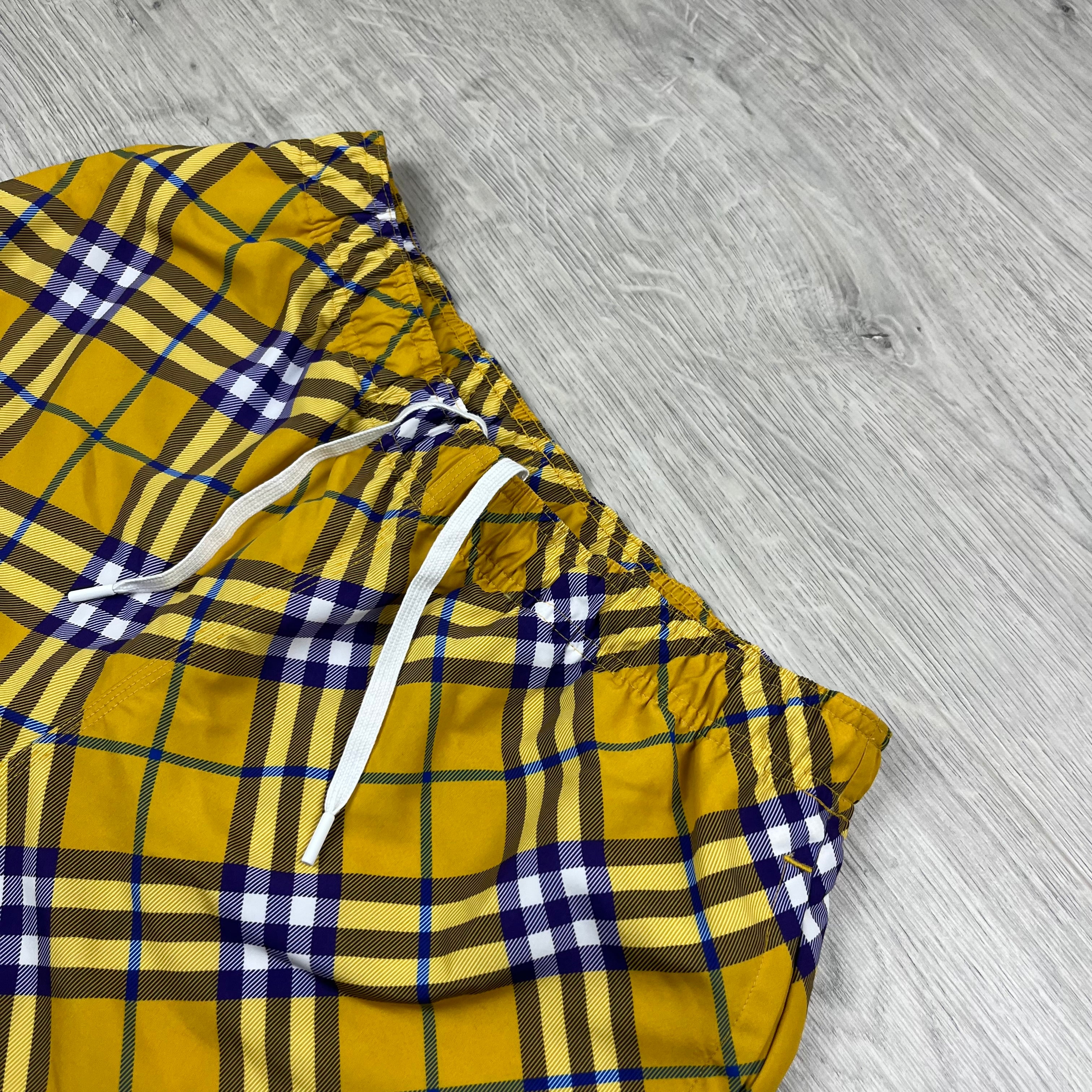 Burberry Vintage Check Swim Shorts in Yellow Pear. On sale at Open Attire.
