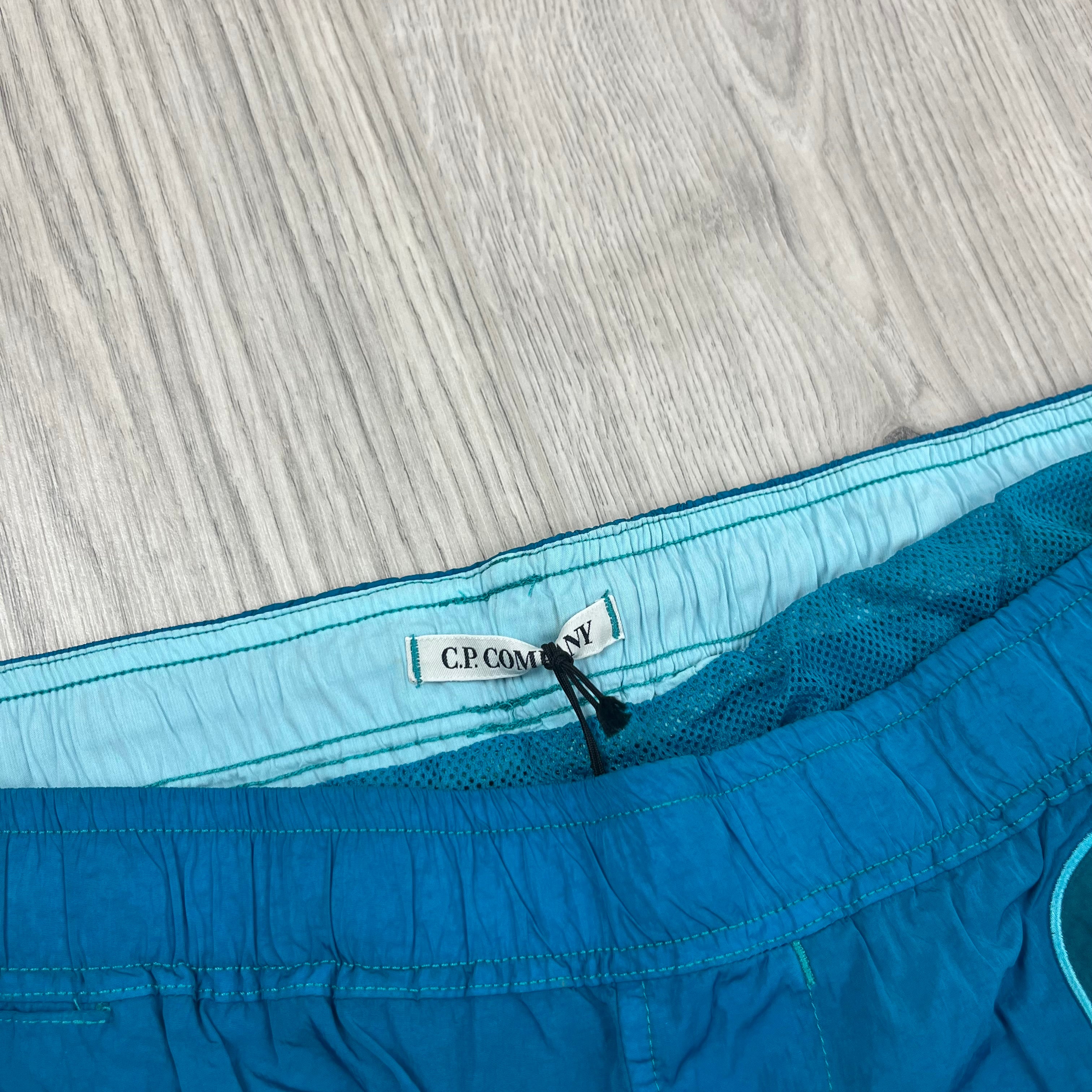 CP Company Chrome-R Swim Shorts in Tile Blue. On sale at Open Attire.