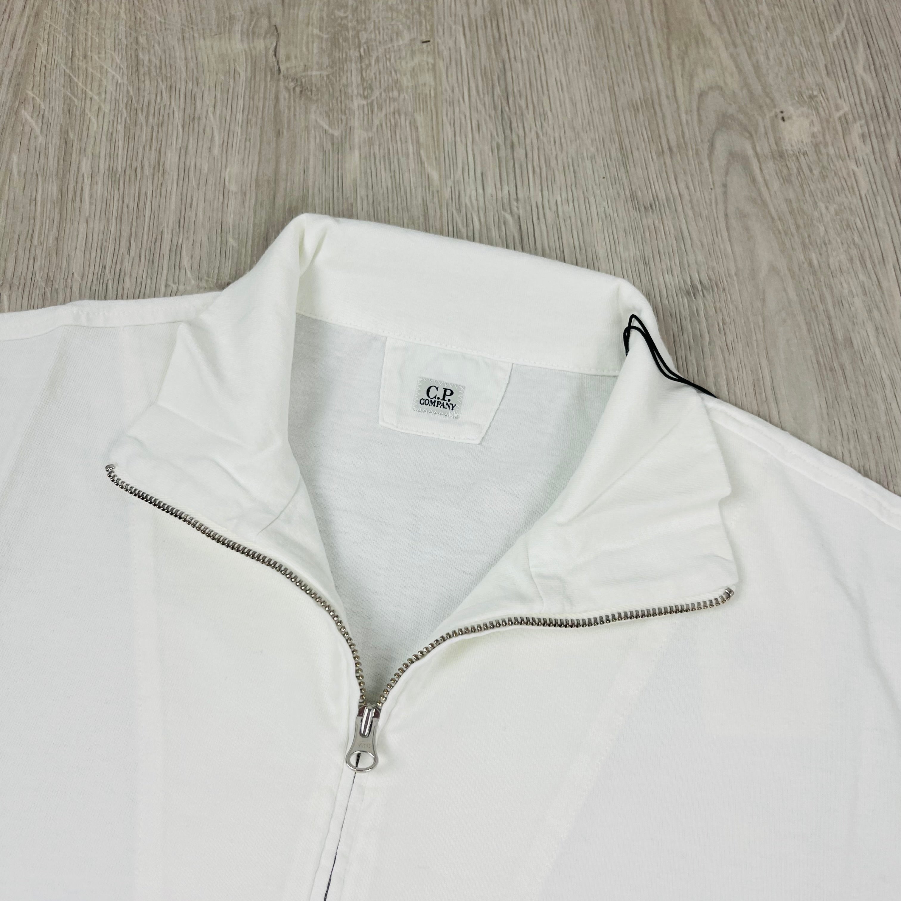 CP Company 1020 Zip Polo Shirt in Gauze White. On sale at Open Attire.