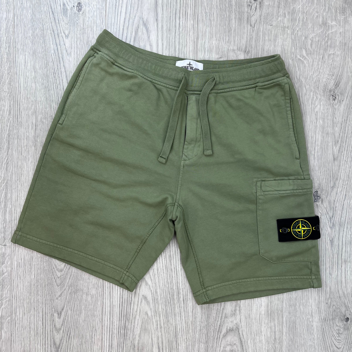 Front view of the Stone Island Jersey Shorts in Laurel Green.