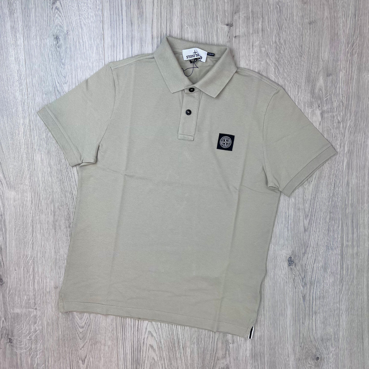 Front view of the Stone Island Patch Polo Shirt in Sand.