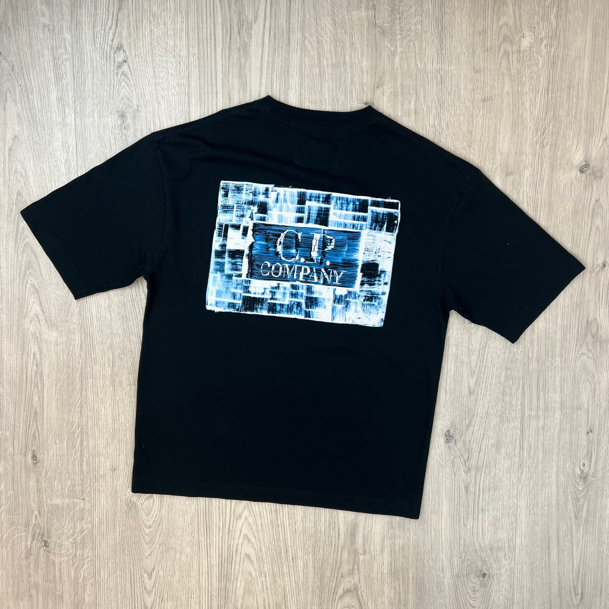 Rear view of the CP Company 30/1 Jersey Graphics T-Shirt in Black. 