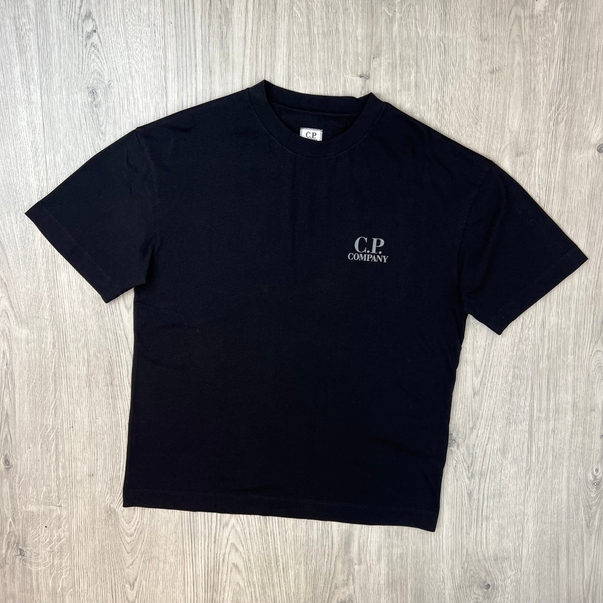 Front view of a CP Company 30/1 Logo T-Shirt in Black. 