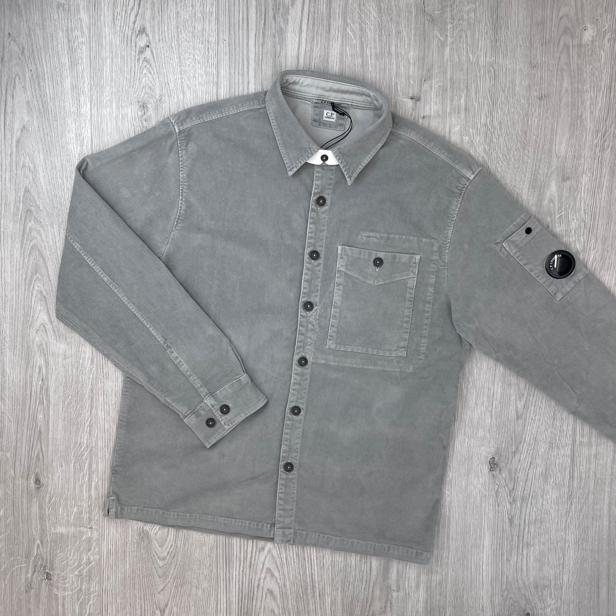 Front view of a CP Company Cotton Corduroy Overshirt in Flint Grey.