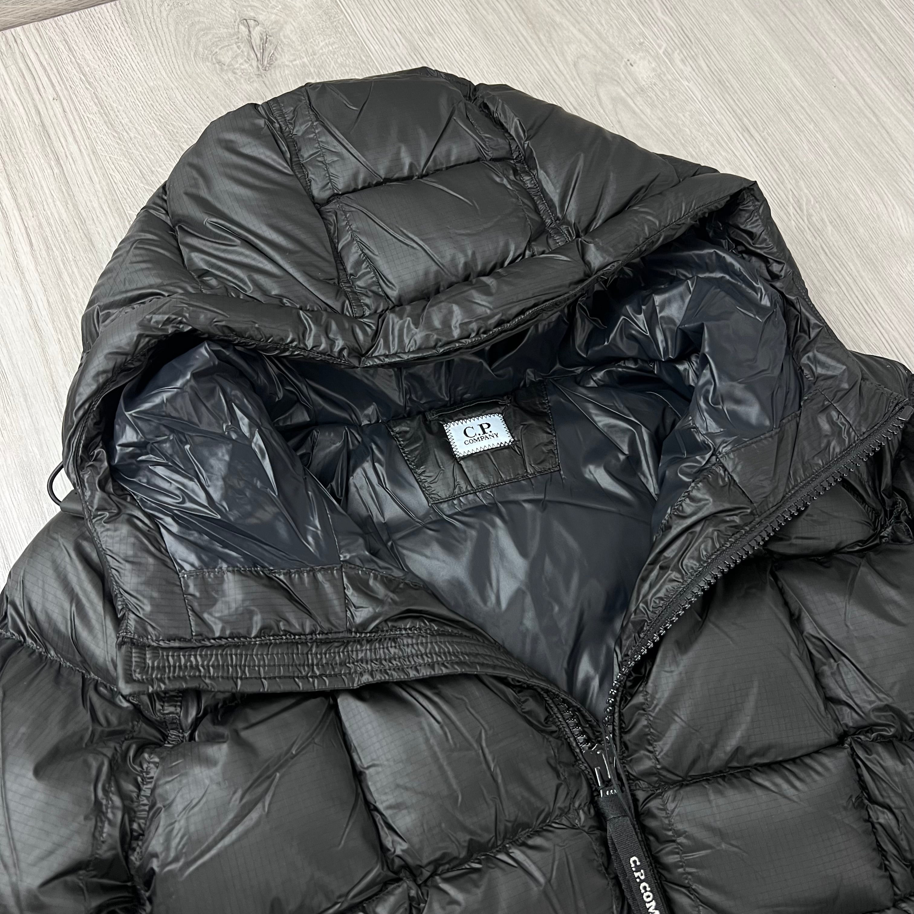 A close up view of the hood and neck of a CP Company D.D. Shell Hooded Down Jacket in Black. 