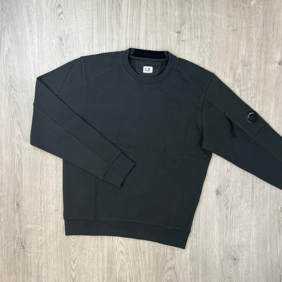 Front view of a CP Company Raised Fleece Sweatshirt in Raven Grey. 