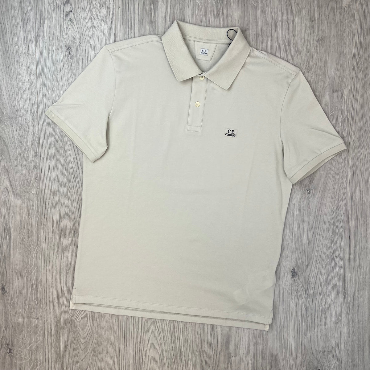 Front view of the CP Company Stretch Piquet Polo Shirt in Silver Birch.