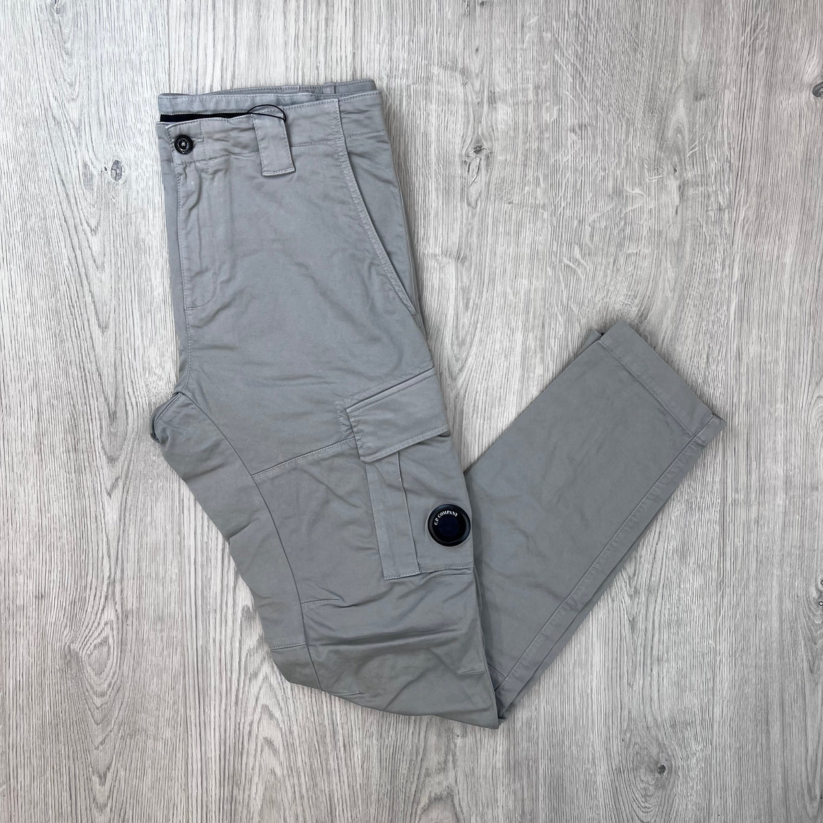 Front view of the CP Company Stretch Sateen Cargo Trousers in Flint Grey.